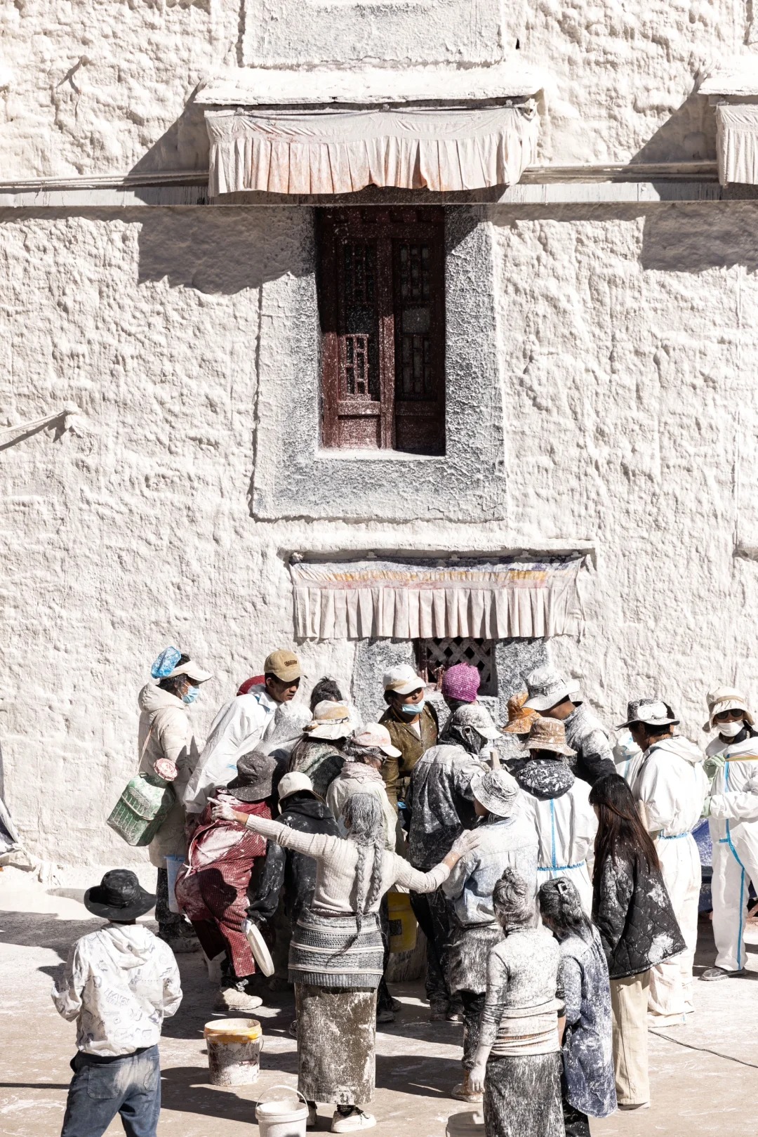 It’s that time of year again for the annual wall painting and dressing of the Potala Palace