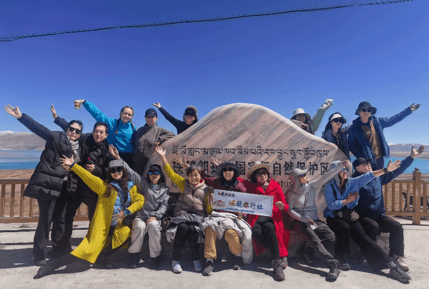 Group photo in front of the commemorative monument in the Mount EBC Protected Area